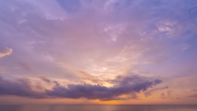 Sky Clouds sunrise TimeLapse nature clouds. Beautiful Light sunrise sky over sea.Scenery Sky Amazing golden cloud flowing in sky background.Travel and website background.High quality footage