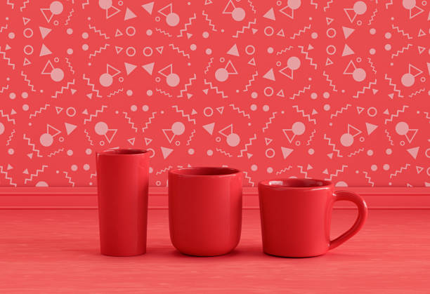 istock Two single red water glasses and a coffee mug side by side on monochrome red kitchen countertop front of red decorative wall, front view, 3d rendering, no people 1394096336
