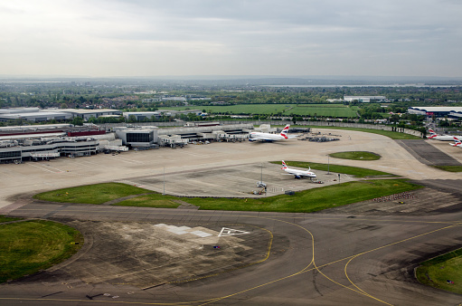 London, UK - April 19, 2022: Aerial view of Heathrow Terminal 4 in London complete with helicopter landing area.  Viewed on a sunny spring morning.