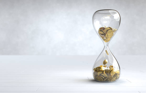 gold coin in the hourglass, time is money concept - coin cheap jar currency imagens e fotografias de stock