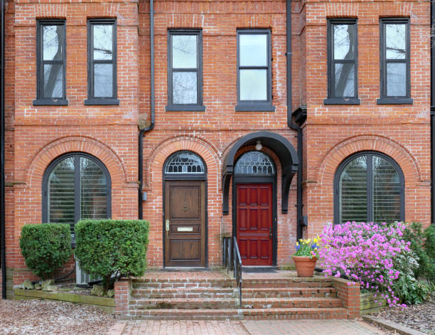 istock Restored and gentrified old brick row houses 1394106489