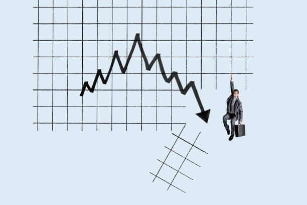 istock Man Hanging On For Dear Life In Bear Market 1394109901