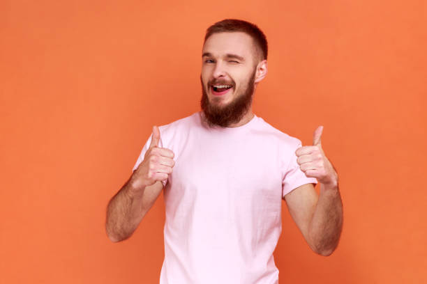 istock Man standing with thumbs up, like gesture, demonstrating approval and agree with suggestion. 1394110703