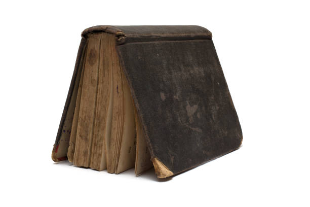 istock Closeup old damaged book tent white background 1394113621