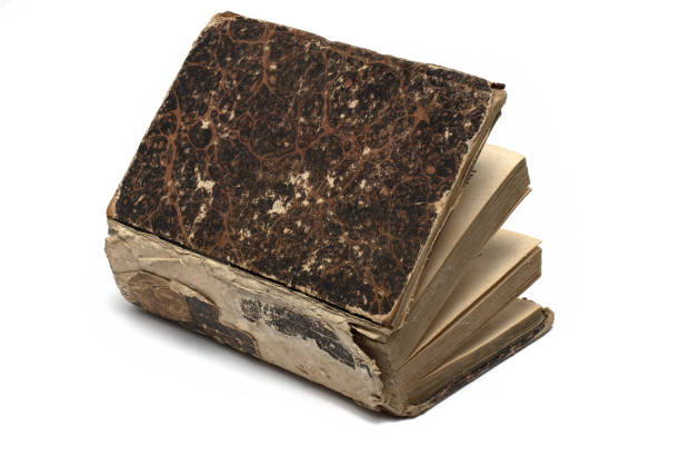 istock Closeup partially opened leather book white background 1394113633