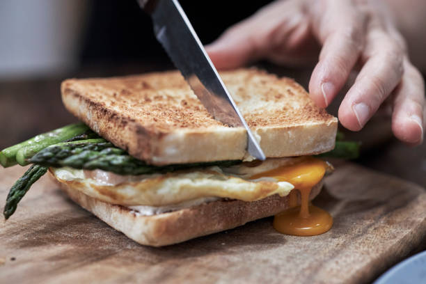 homemade sandwich, with fried egg and asparagus stock photo