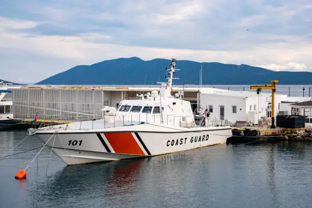 A coast guard motor boat moored at the pier