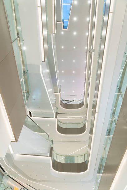 istock low angle view of modern shopping mall interior. 1394118163