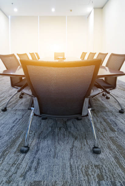 istock Modern boardroom with early morning light effect 1394121087