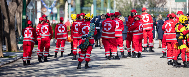Greece Athens, March 25 2022. Hellenic Red Cross, Nonprofit Organization with Voluntary Work. Emergency Medic Assistance from Professional in red and white uniform. Banner