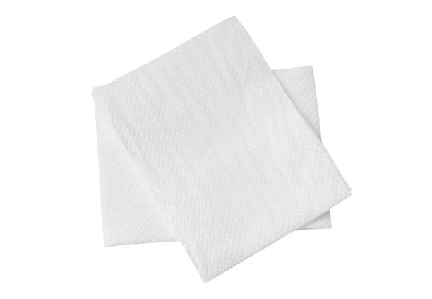 istock Two folded pieces of white tissue paper or napkin in stack isolated on white background with clipping path 1394123200