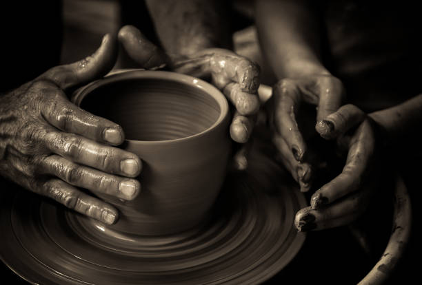 istock working on the potter's wheel fragmentary portrait 1394125487