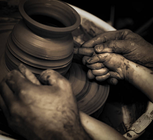 istock working on the potter's wheel fragmentary portrait 1394125512
