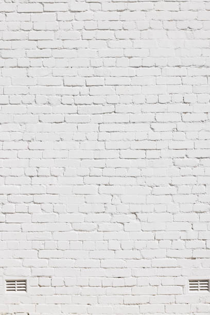 istock Part of an old white brick wall 1394126061