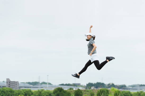 istock Image of a woman exercising (rise, momentum, flight) 1394128337