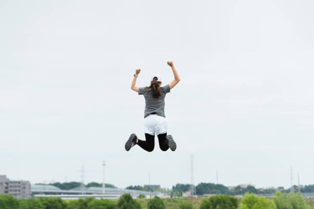 istock Image of a woman exercising (rise, momentum, flight) 1394128338