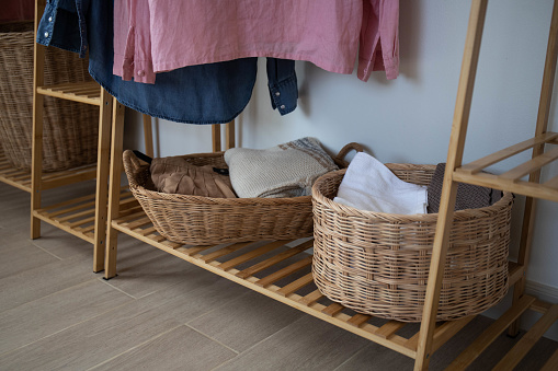 The woven basket is placed on the clothesline.