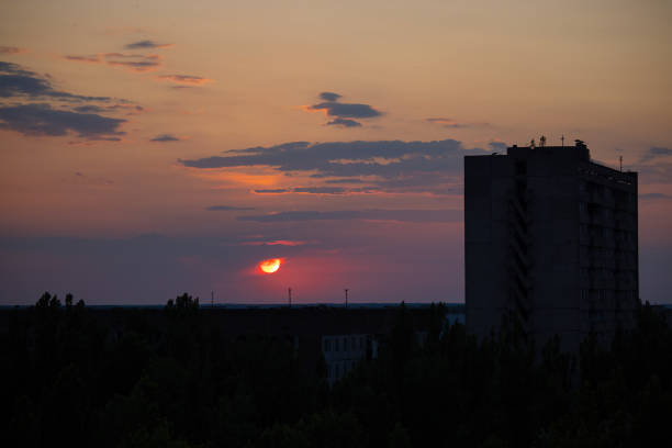 Sunset in Pripyat Beautiful sunset in the dead city of Pripyat war zone stock pictures, royalty-free photos & images