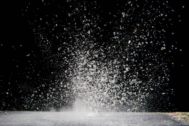 istock Explosion of white powder isolated on black background. 1394132940