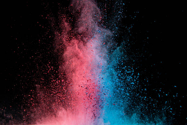 istock Explosion of colored powder isolated on black background. 1394133079