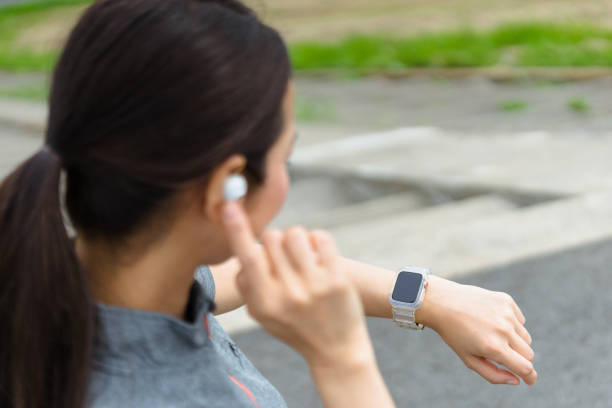 istock woman running looking at a smartwatch 1394133922