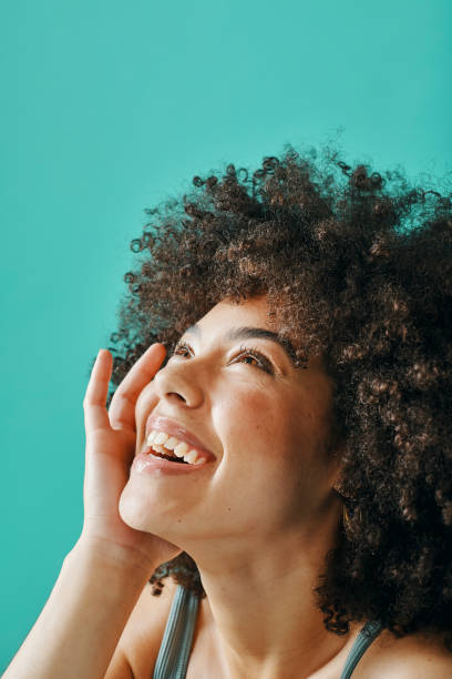 istock Mixed race woman posing with afro hair in the studio 1394135164