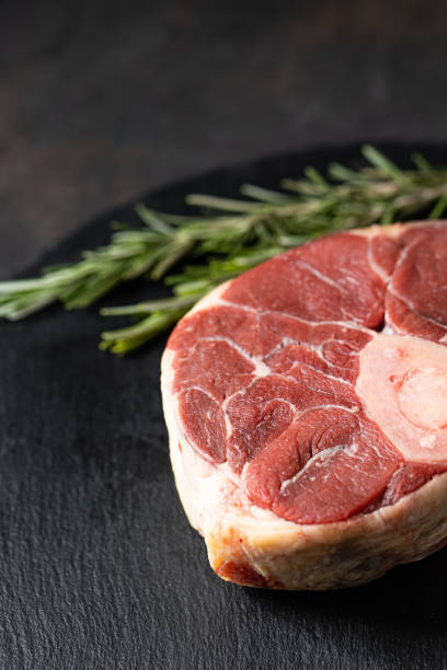 istock Fresh raw beef meat osso buco on black background 1394136850