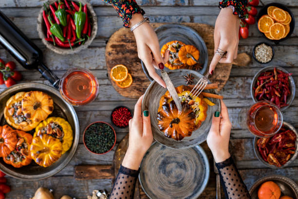 istock Celebration dinner with rose wine and mini stuffed pumpkins. 1394137426