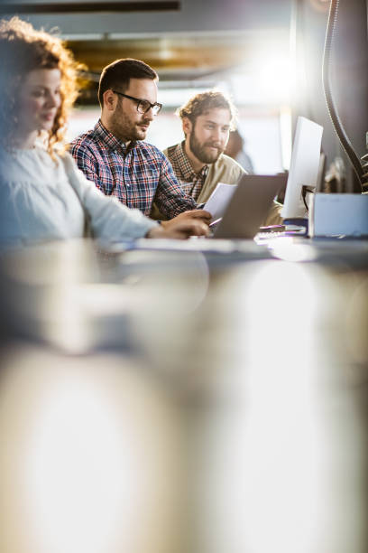 istock Group of colleagues working at software company. 1394138160