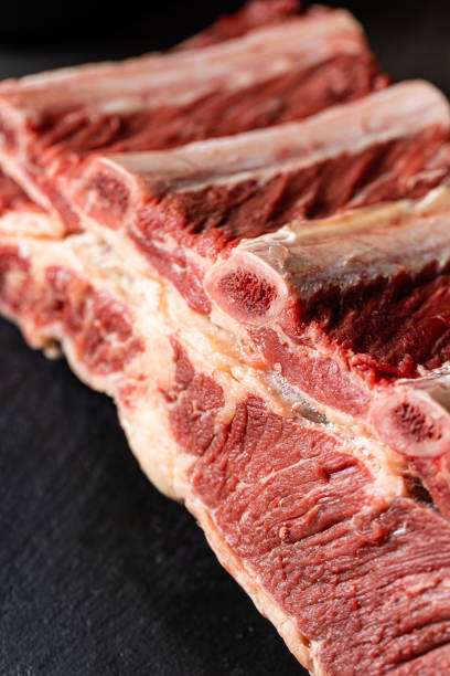 istock Fresh raw beef ribs meat on black background 1394138407