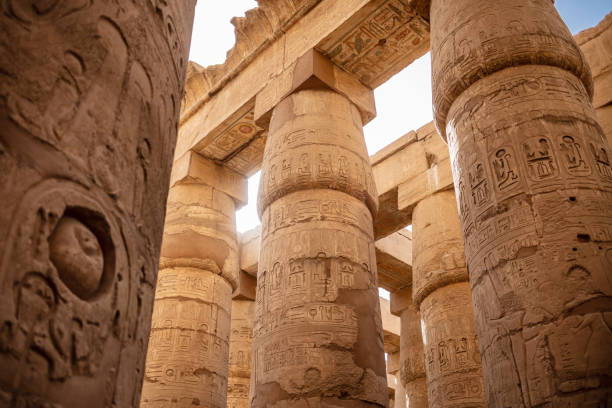 istock Different columns with hieroglyphs in Karnak temple. Karnak temple is the largest complex in ancient Egypt. 1394139300