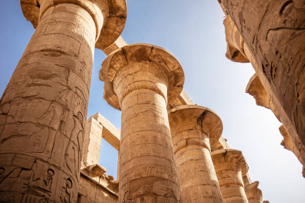 istock Different columns with hieroglyphs in Karnak temple. Karnak temple is the largest complex in ancient Egypt. 1394139404