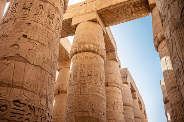 istock Different columns with hieroglyphs in Karnak temple. Karnak temple is the largest complex in ancient Egypt. 1394139517
