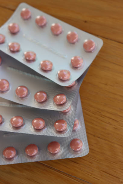 istock Pink round pills in blister packaging 1394142990