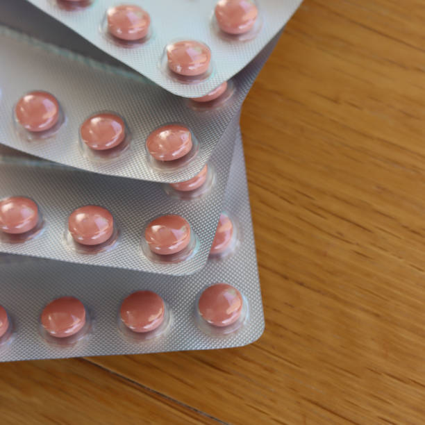 istock Pink round pills in blister packaging 1394142998