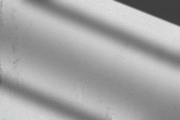 istock light and shadow concept on gray cement floor 1394144559