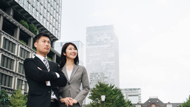 istock Image of men and women doing business 1394145541