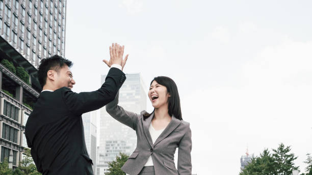 istock Men and women with high five (business image) 1394145543
