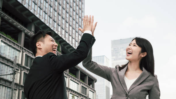 istock Men and women with high five (business image) 1394145545