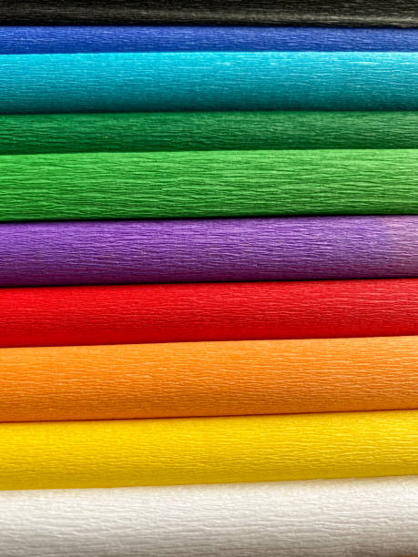 istock Stacks of different colored non-woven papers in rainbow colors 1394145913