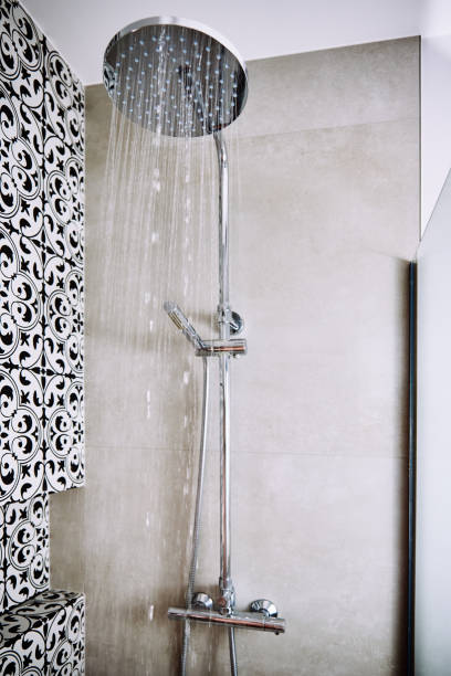 istock Water flowing from shower head in bathroom 1394151498