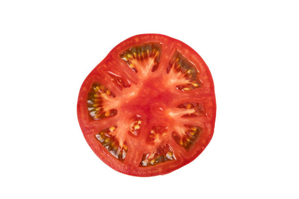 istock Slice of red ripe large tomato isolated on white background. 1394151537
