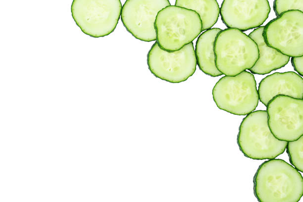 istock Frame made from fresh sliced cucumbers on white background with copy space. 1394152709