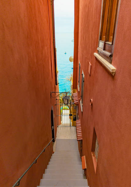 Positano, Italy - 16 April 2022 - The touristic sea town in southern Italy, province of Salerno in Amalfi Coast, with colorated historical center and very famous 'Sentiero degli Dei' trekking path. Here in particular a view of suggestive alley