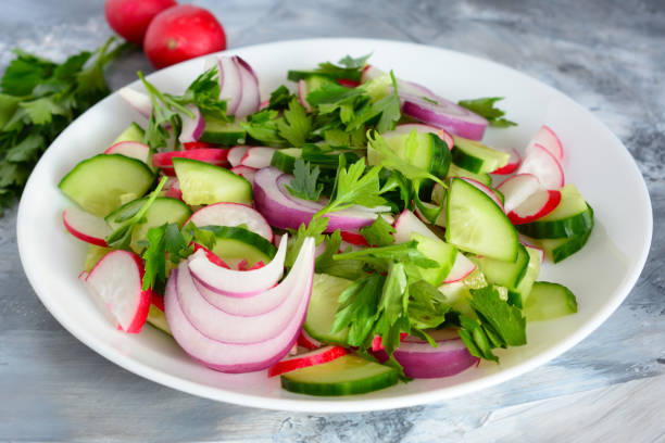 istock fresh vegetable salad with radish and red onion, close-up 1394155505
