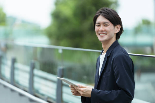 istock Image of men with tablet PCs and IoT 1394155593