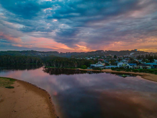 istock Sunrise reflections and clouds at the seaside with lagoon 1394155604
