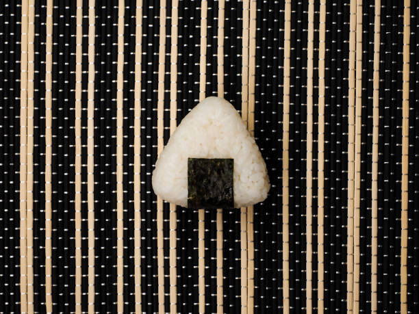 Single Onigiri. Healthy snack. Japanese rice ball. Top view.