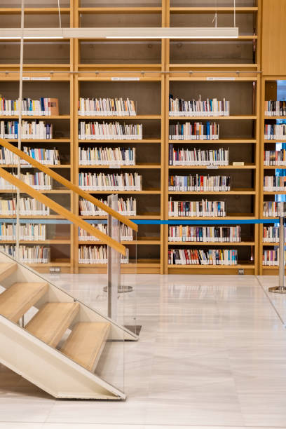 Books lined up on library book shelf