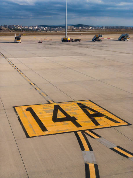 istock Airport runway number 14 A pilot guiding sign 1394155873
